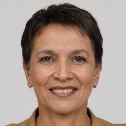 Joyful white adult female with short  brown hair and brown eyes