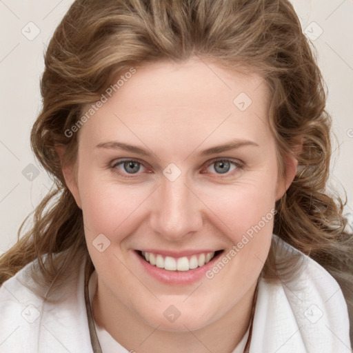 Joyful white young-adult female with medium  brown hair and blue eyes