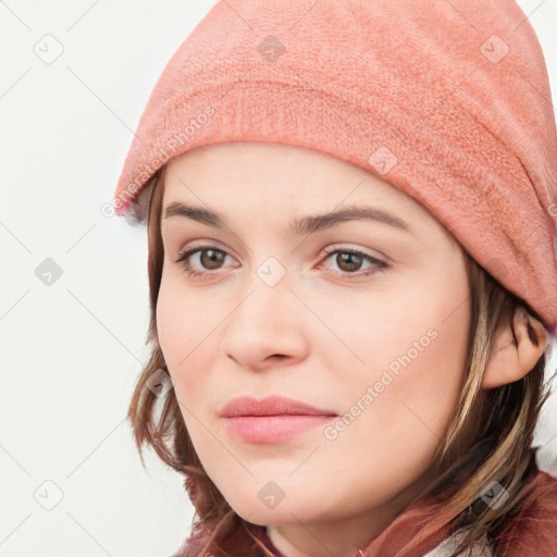 Neutral white young-adult female with long  brown hair and brown eyes