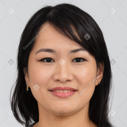 Joyful asian young-adult female with medium  brown hair and brown eyes