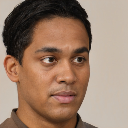 Neutral latino young-adult male with short  brown hair and brown eyes