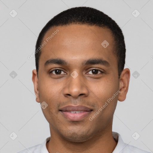 Joyful black young-adult male with short  black hair and brown eyes