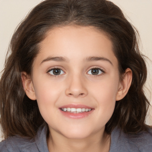 Joyful white child female with medium  brown hair and brown eyes