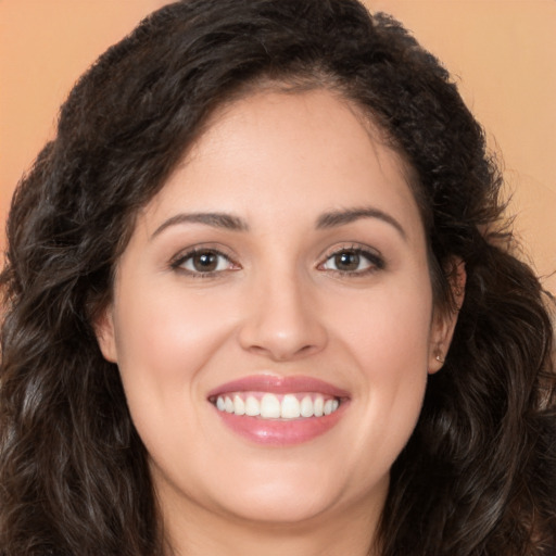 Joyful white young-adult female with long  brown hair and brown eyes