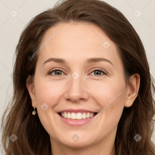 Joyful white adult female with long  brown hair and grey eyes