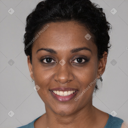 Joyful black young-adult female with short  black hair and brown eyes