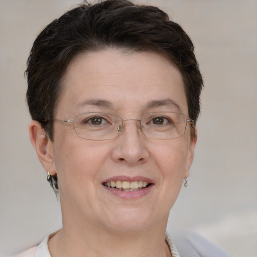 Joyful white adult female with short  brown hair and brown eyes