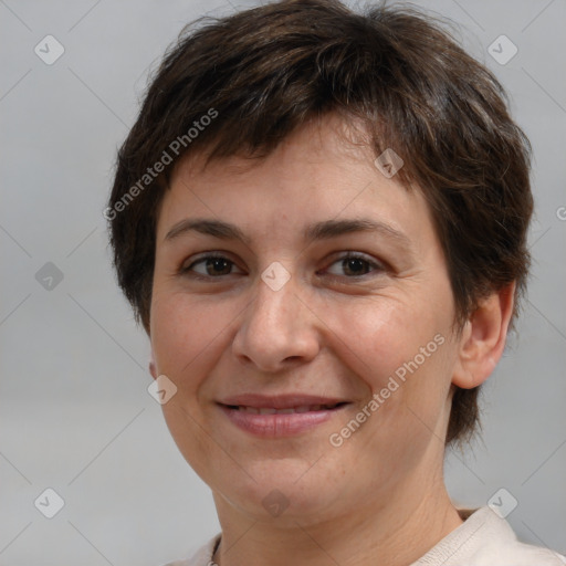 Joyful white adult female with short  brown hair and brown eyes