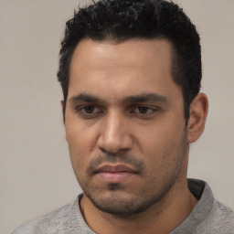 Neutral white young-adult male with short  black hair and brown eyes