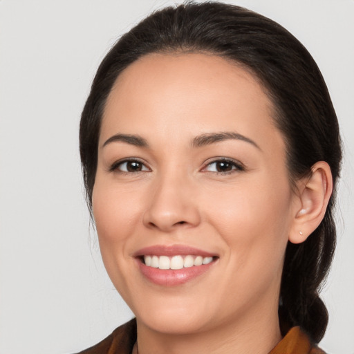 Joyful white young-adult female with medium  brown hair and brown eyes