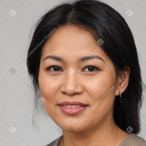 Joyful asian adult female with medium  brown hair and brown eyes