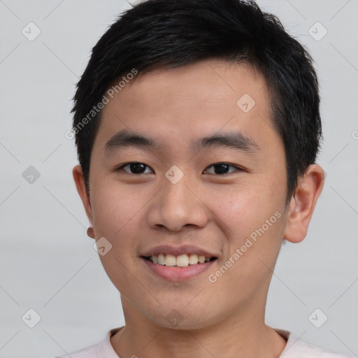 Joyful asian young-adult male with short  black hair and brown eyes