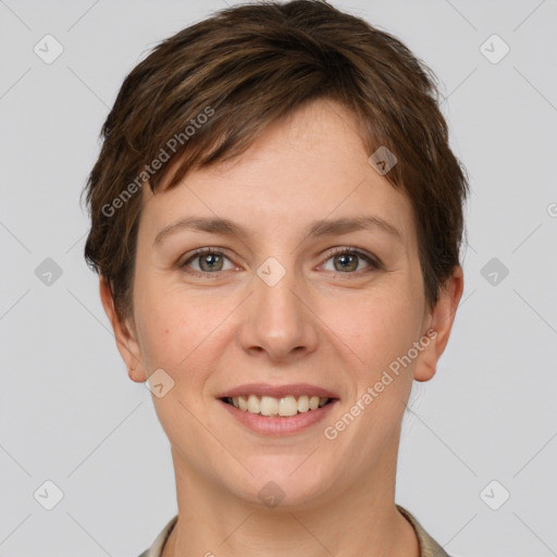 Joyful white young-adult female with short  brown hair and grey eyes