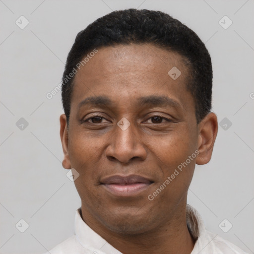 Joyful latino adult male with short  black hair and brown eyes