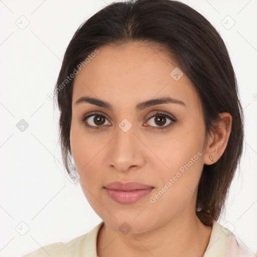 Joyful latino young-adult female with medium  brown hair and brown eyes