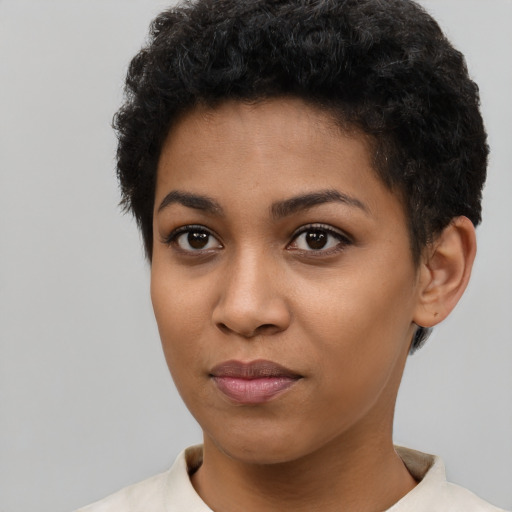 Joyful latino young-adult female with short  black hair and brown eyes