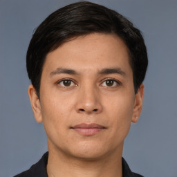 Joyful white young-adult male with short  black hair and brown eyes