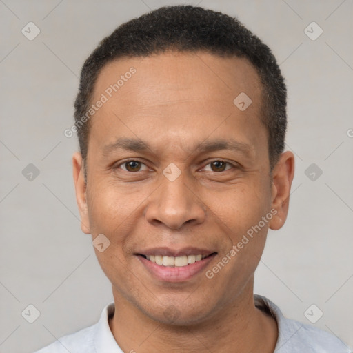 Joyful latino adult male with short  black hair and brown eyes