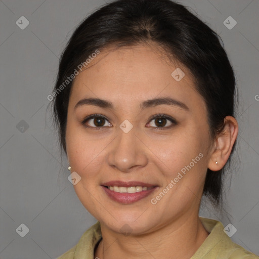 Joyful latino young-adult female with medium  brown hair and brown eyes