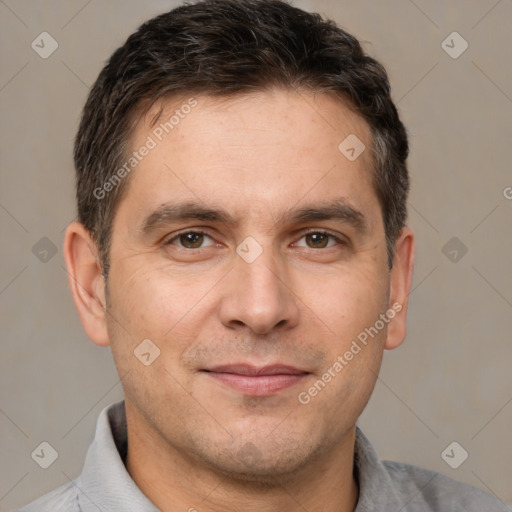 Joyful white adult male with short  brown hair and brown eyes