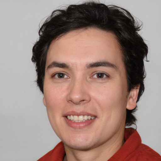 Joyful white young-adult male with medium  brown hair and brown eyes