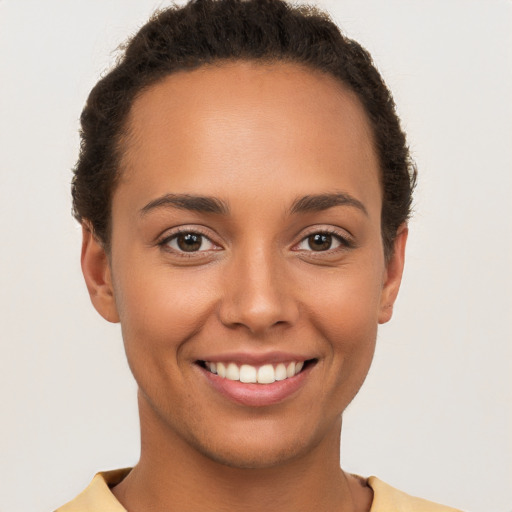 Joyful white young-adult female with short  brown hair and brown eyes