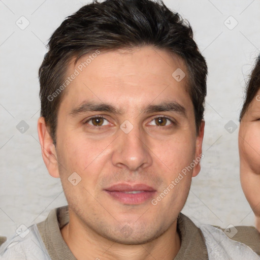 Joyful white adult male with short  brown hair and brown eyes