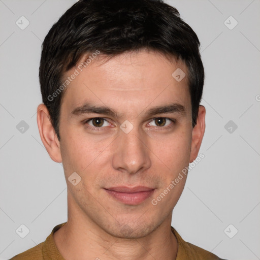 Joyful white young-adult male with short  black hair and brown eyes