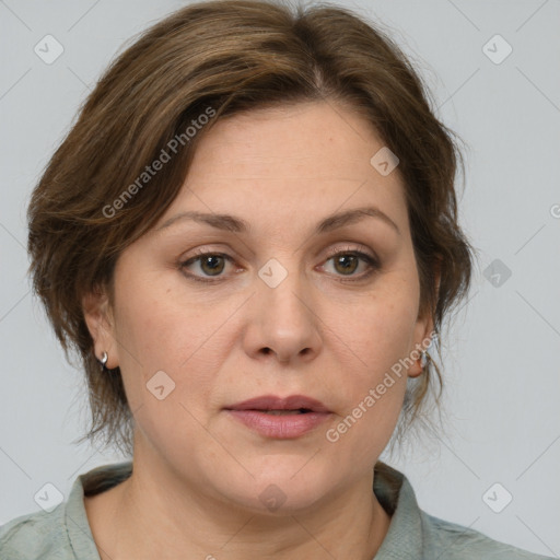 Joyful white adult female with medium  brown hair and grey eyes