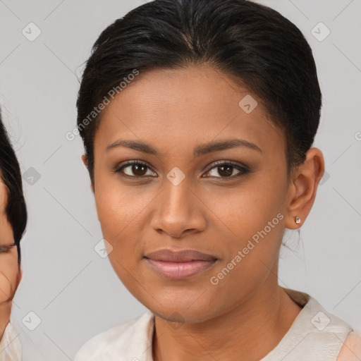 Joyful black young-adult female with medium  brown hair and brown eyes