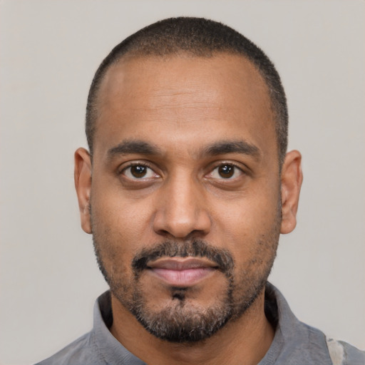 Neutral latino adult male with short  black hair and brown eyes