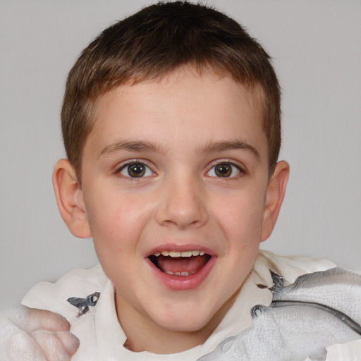 Joyful white child male with short  brown hair and brown eyes