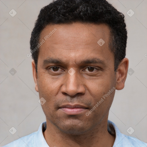 Neutral latino adult male with short  black hair and brown eyes