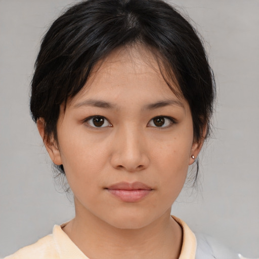 Neutral asian young-adult female with medium  brown hair and brown eyes