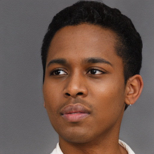 Neutral black young-adult male with short  black hair and brown eyes