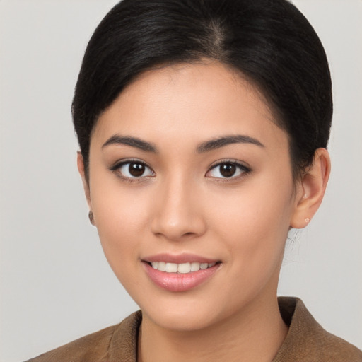 Joyful asian young-adult female with short  brown hair and brown eyes