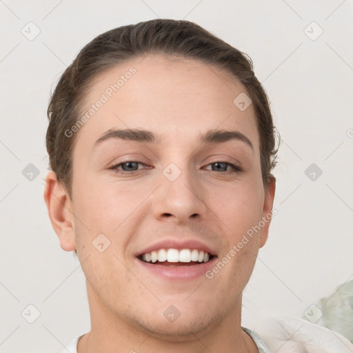 Joyful white young-adult female with short  brown hair and brown eyes