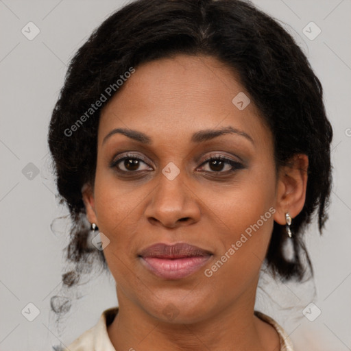 Joyful black young-adult female with medium  brown hair and brown eyes