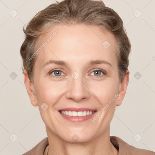 Joyful white adult female with short  brown hair and grey eyes