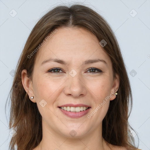 Joyful white adult female with long  brown hair and brown eyes