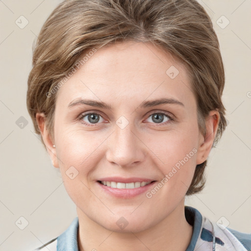 Joyful white young-adult female with medium  brown hair and grey eyes