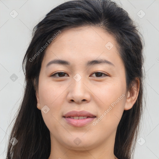 Joyful asian young-adult female with long  brown hair and brown eyes