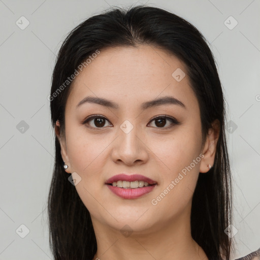 Joyful latino young-adult female with long  brown hair and brown eyes