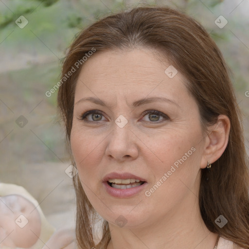 Joyful white adult female with medium  brown hair and brown eyes