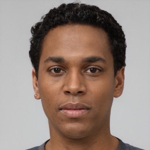 Neutral black young-adult male with short  black hair and brown eyes