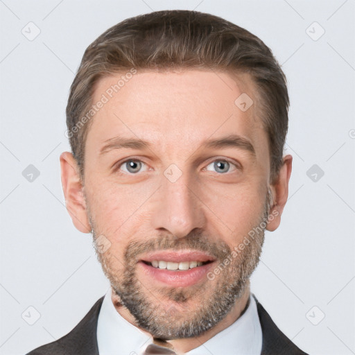 Joyful white adult male with short  brown hair and grey eyes