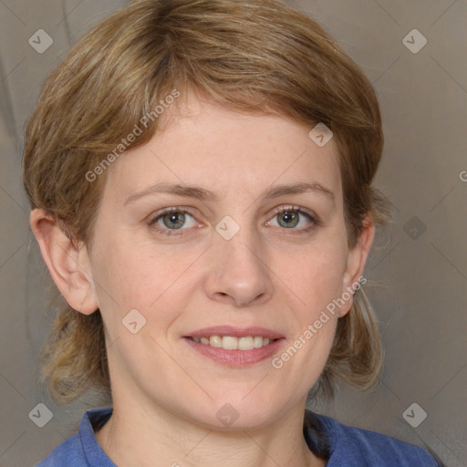 Joyful white young-adult female with medium  brown hair and blue eyes