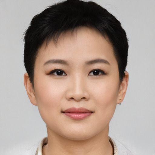 Joyful asian young-adult female with short  black hair and brown eyes