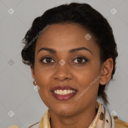 Joyful black young-adult female with long  brown hair and brown eyes