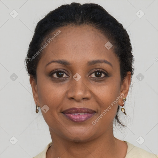 Joyful black adult female with short  brown hair and brown eyes